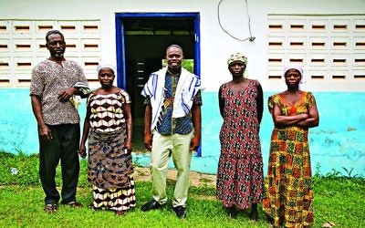 Spiritual leader Alex Armah, centre, with community members at shacharit (morning) service at Tifereth Israel Synagogue, House of Israel Jewish Community in New Adiembra, Ghana. 
Photographed in February 2014