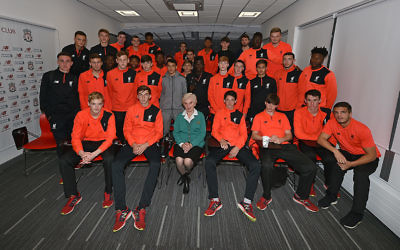 Renee (centre in green) with members of Liverpool's youth squads, during one of her talks this week