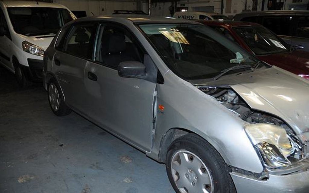 A crashed up car posted by the North Wales police