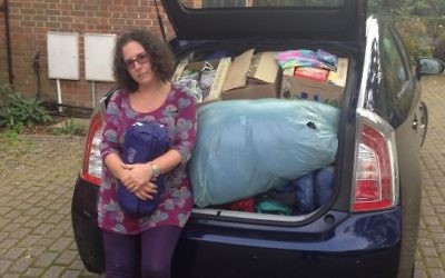 Holly Kal-Weiss with a car-full of undelivered aid