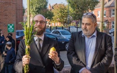 Rabbi Baruch Levine with Yousif Al-Khoei, waving the lulav and etrog