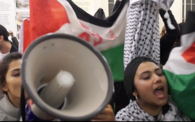 Demonstrators disrupting an event with Israeli speaker at UCL campus.