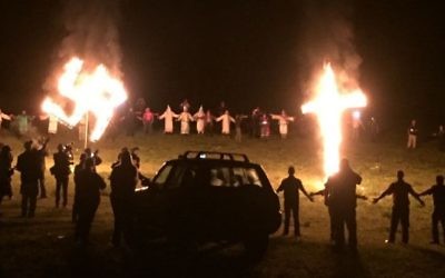 An image of the KKK burning a swastika and a cross, provided by Hope Not Hate