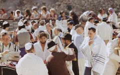 Bob Dylan, third from left, with his son Jesse, in the white tallis on right, at the Western Wall in September 1983. (Facebook) Bob Dylan, third from left, with his son Jesse, in the white tallis on right, at the Western Wall in September 1983. (Facebook)