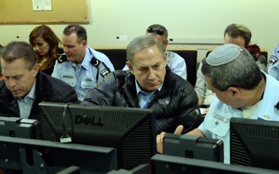 Israeli Prime Minister Benjamin Netanyahu speaks with officials about fighting forest fires in Israel (Photo by Haim Zach / GPO via JINIPIX)