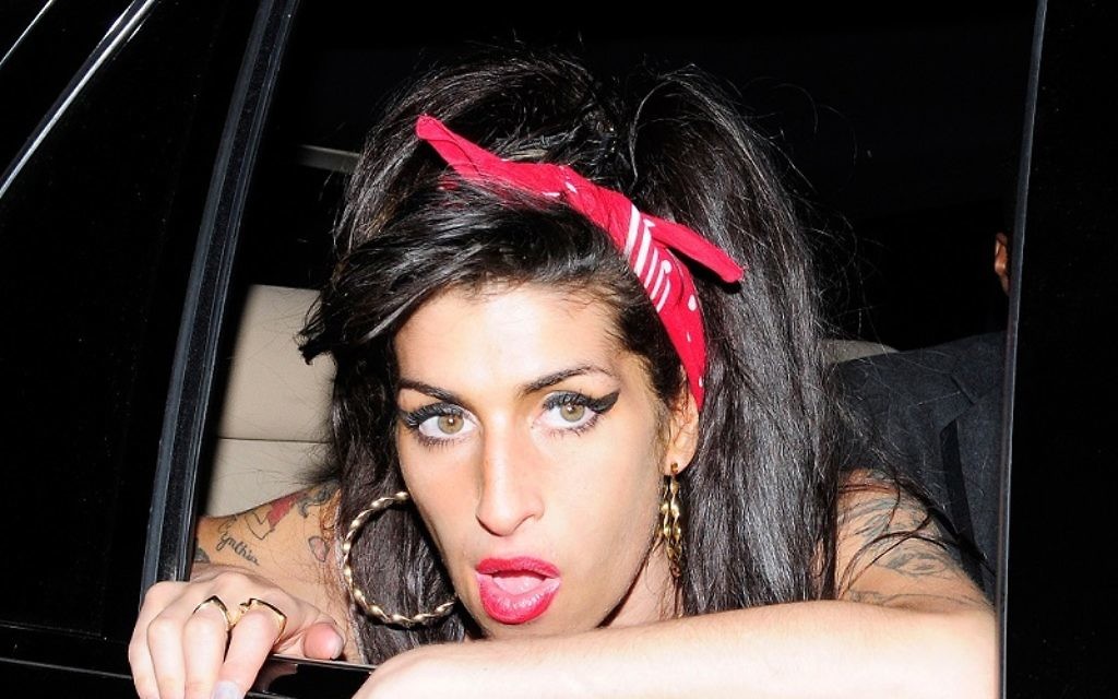 Amy Winehouse arrives at a Mark Ronson gig in 2010. Credit: Opticphotos.com