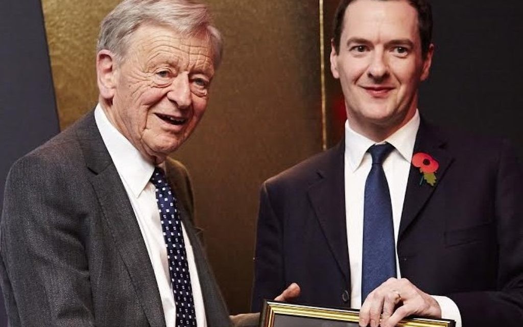 Lord Dubs being presented Peer of the Year Award by former Chancellor George Osborne
