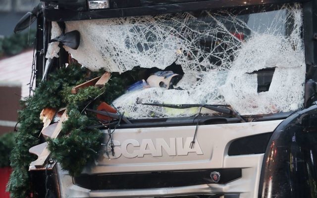 The smashed window of the cabin of a truck which ran into a crowded Christmas market on Monday evening killing several people (AP Photo/Markus Schreiber)