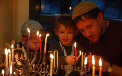 Limmud conference participants light Chanukah candles in December 2016