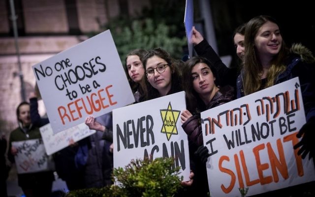Protesters holding placards during near the Prime minister residence in Jerusalem against Trump’s recent anti-refugee and anti-migrant Executive Orders (Photo by: JINIPIX)