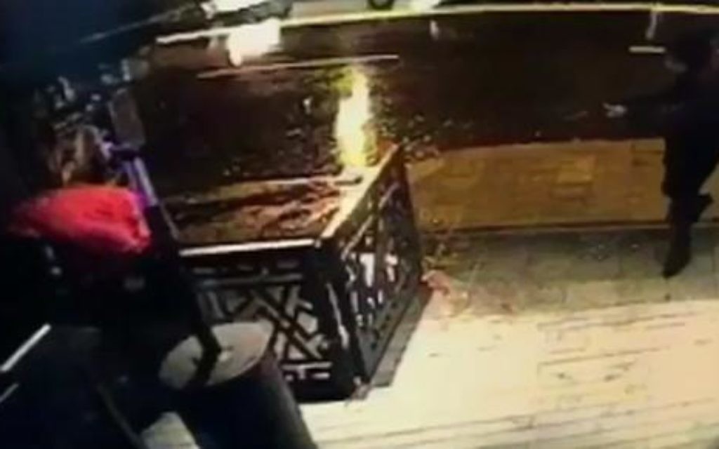 This image taken from CCTV provided by Haberturk Newspaper Sunday Jan. 1, 2017 shows the attacker, armed with a long-barrelled weapon, shooting his way into the Reina nightclub in Istanbul, Turkey on Sunday morning.