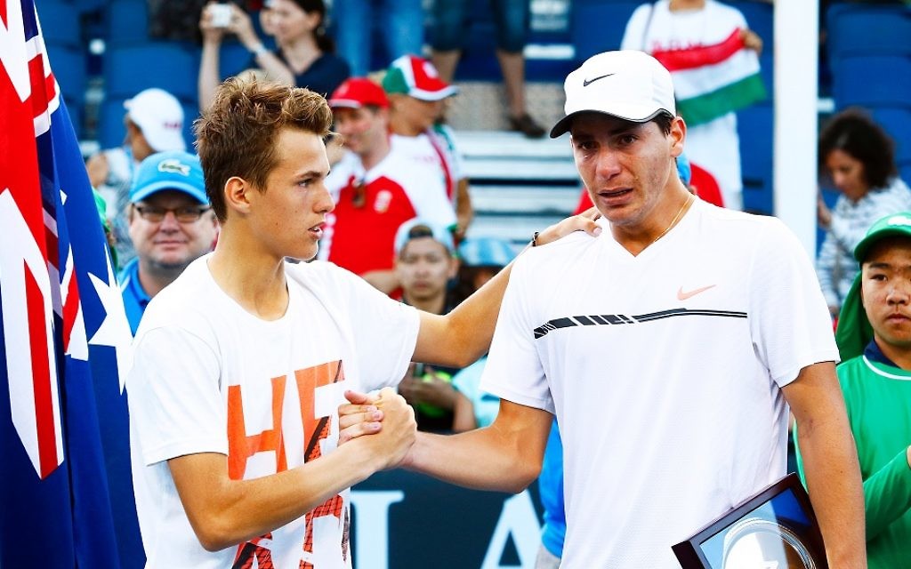 Yshai Oliel (right) in tears after losing the Australian Open junior boy's final. Picture: Peter Haskin/AJN