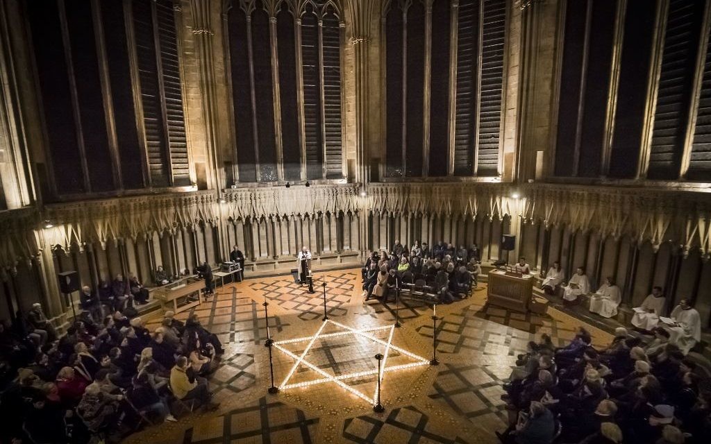 600 candles in the shape of the Star of David are seen during a commemoration for Holocaust Memorial Day at York Minster, York, 2017.