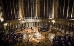 600 candles in the shape of the Star of David are seen during a commemoration for Holocaust Memorial Day at York Minster, York, 2017.