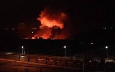 Mezzeh military airport in flames on Friday.