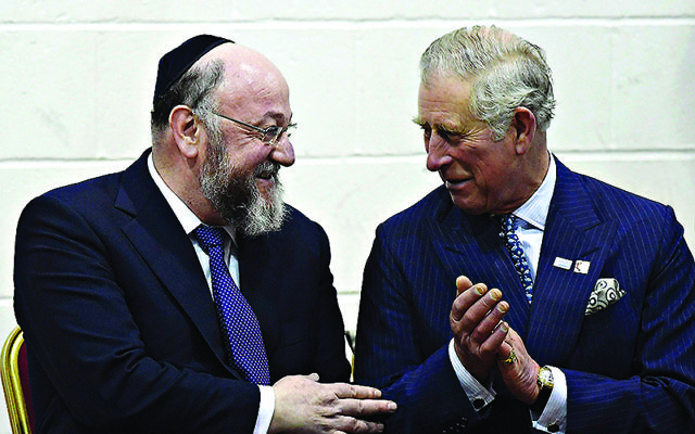 The Prince of Wales (right) speaks with chief rabbi Ephraim Mirvis during a visit to Yavneh College