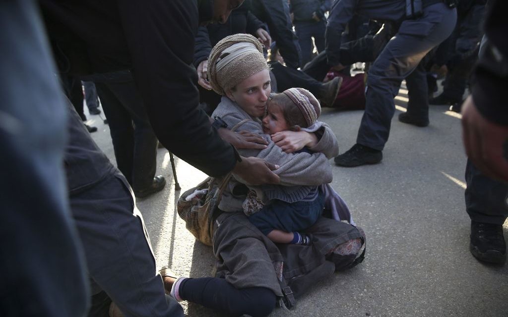 Israeli police evict settlers in the West Bank outpost of Amona, Thursday, Feb. 2, 2017.   (AP Photo/Oded Balilty)