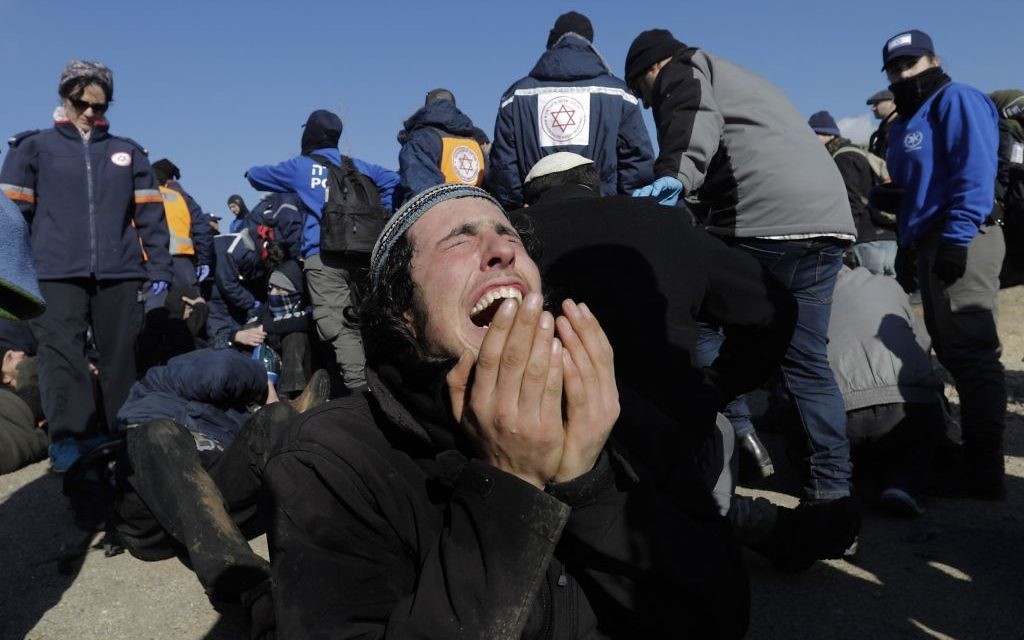 Israeli police detain settlers in the West Bank outpost of Amona, Thursday, Feb. 2, 2017.   (AP Photo/Oded Balilty)