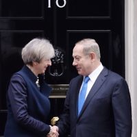 Prime Minister Theresa May greets Israeli Prime Minister Benjamin Netanyahu as he arrives in Downing Street, (Photo credit: Stefan Rousseau/PA Wire)