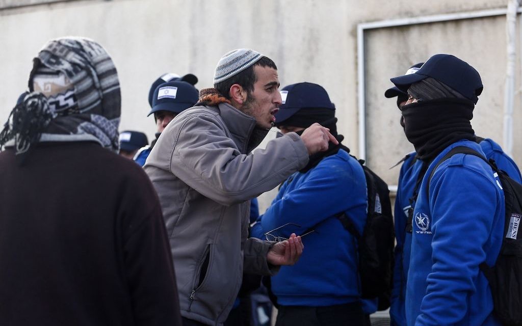 Israeli police evict settlers from the West Bank outpost of Amona, Wednesday. (Photo by: JINIPIX)