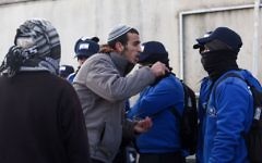 Israeli police evict settlers from the West Bank outpost of Amona, Wednesday. (Photo by: JINIPIX)