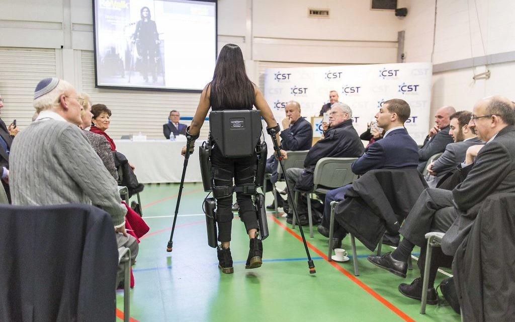 Nicki Donnelly demonstrating the suit to the audience, which featured members of the Jewish community and current and former police officers (Photo credit: Jason Glass)