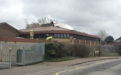 A screenshot from from a video showing Borehamwood Shul with emergency workers on its roof