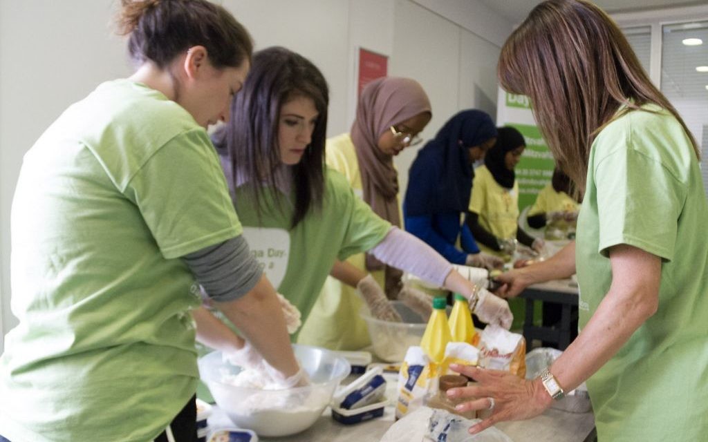 Jewish and Muslim volunteers collecting on Sadaqa Day Jewish and Muslim volunteers collecting on Sadaqa Day