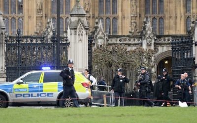 Police close to the Palace of Westminster, London, after sounds similar to gunfire have been heard close to the Palace of Westminster. A man with a knife has been seen within the confines of the Palace, eyewitnesses said. (Photo credit: Victoria Jones/PA Wire)