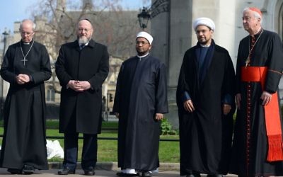 (From the left) Archbishop of Canterbury, the Most Rev Justin Welby, Chief Rabbi Ephriam Mirvis, Sheikh Ezzat Khalifa, Sheikh Mohammad al Hilli and Cardinal Vincent Nichols, Archbishop of Westminster, take part in a vigil outside Westminster Abbey.