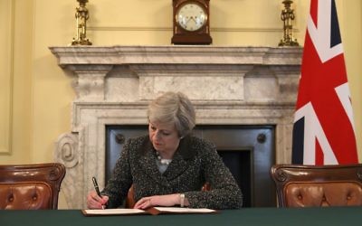Prime Minister Theresa May in the cabinet signing the Article 50 letter, as she prepares to trigger the start of the UK's formal withdrawal from the EU 

(Photo credit: Christopher Furlong/PA Wire)