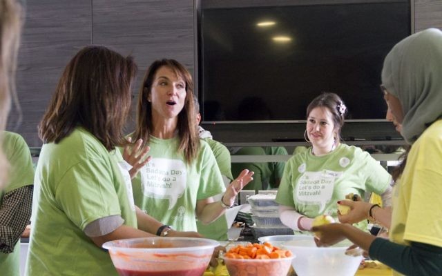 Daniella Pears of the Pears Foundation and Mitzvah Day (second left) taking part in Sadaqa Day