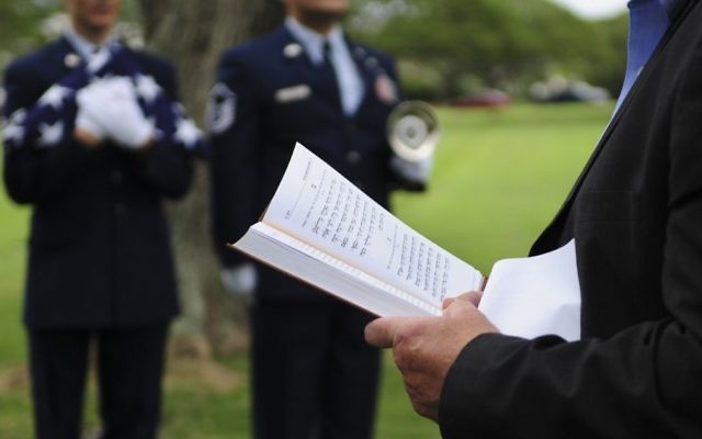 A prayer is read during a memorial service for Staff. Sgt. Jack Weiner, U.S. Army Air Forces, at the National Memorial Cemetery of the Pacific, Feb. 28, 2017. 

 (U.S. Air Force photo by Tech. Sgt. Heather Redman)
