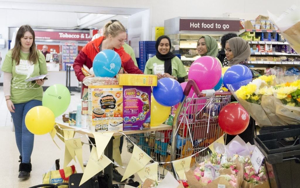 Jewish and Muslim volunteers collecting on Sadaqa Day Jewish and Muslim volunteers collecting on Sadaqa Day