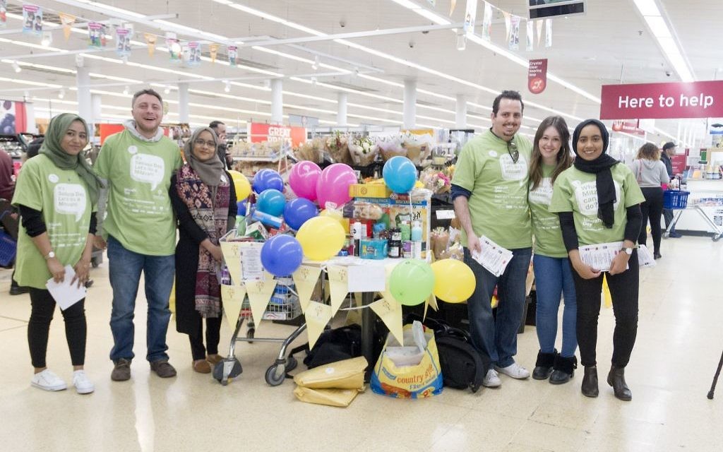 Jewish and Muslim volunteers collecting on Sadaqa Day Jewish and Muslim volunteers collecting on Sadaqa Day