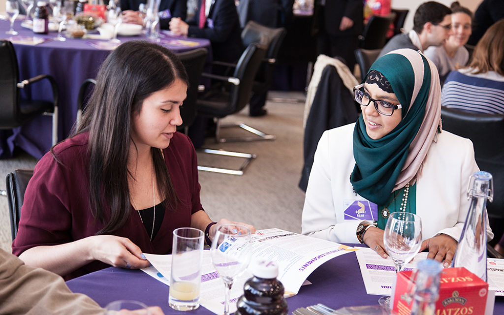 Judith Flacks of the Jewish Leadership Council taking with Onjali Rauf at the interfaith seder