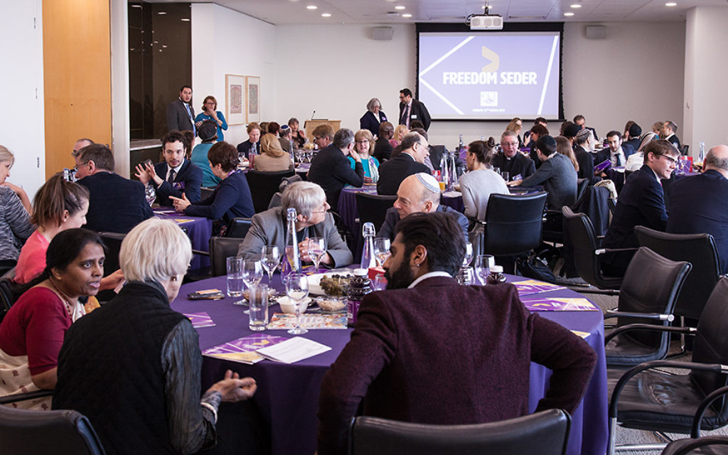 Guests listening to Maureen Kendler, Teaching Fellow and Lead Tutor at the London School of Jewish Studies (LSJS), who hosted the seder
