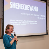 Maureen Kendler speaking at an interfaith seder in March 2017