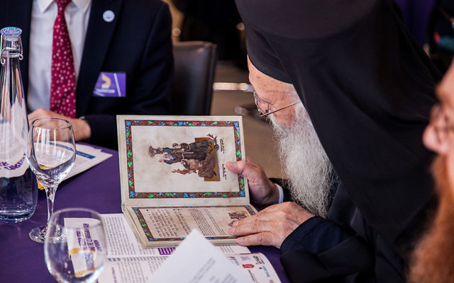 Archbishop Gregorios of the Greek Orthodox Church, Great Britain and Thyateira, reading a Hagaddah