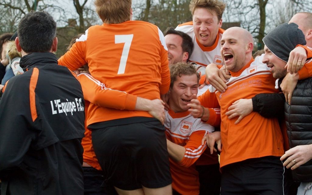 L'Equipe celebrate winning Division Two