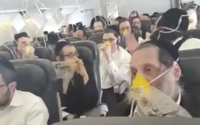 Screenshot from a video showing ultra-Orthodox Jewish passengers on board a flight from London Stansted to Rzeszow in Poland, March 19, 2017. The plane made an emergency landing in Amsterdam. (Hiemishe LIVE NEWS/Twitter)