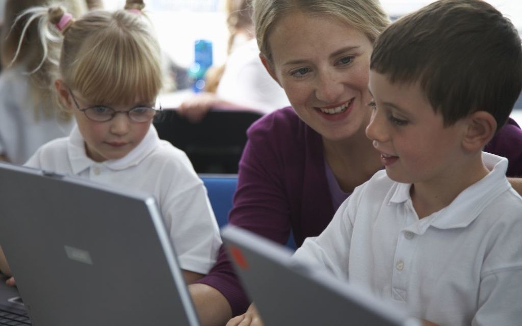 A teacher with her students