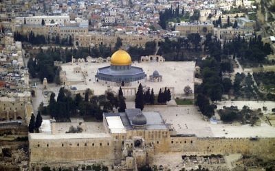 An aerial view of the Temple Mount in the Old City of Jerusalem, featuring the Golden Dome of the rock and Al Aqsa mosque