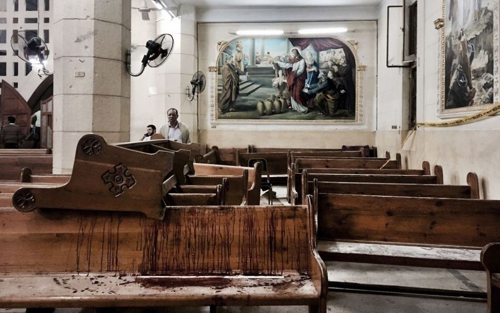 A girl looks at damage inside the St. George Church after a suicide bombing, in the Nile Delta town of Tanta 

 (AP Photo/Nariman El-Mofty)