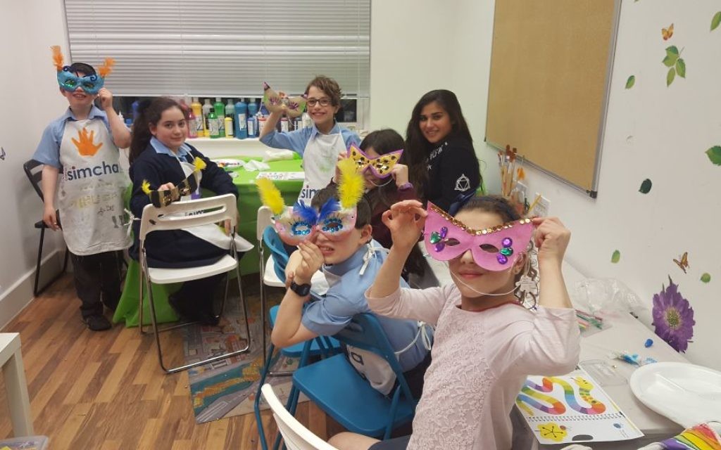 Leah (second from left) with other Camp Simcha siblings at the art group