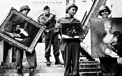 Nazi soldiers pose with Nazi-looted art