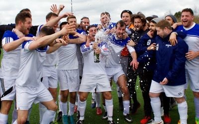 Redbridge B celebrate winning the Division One title