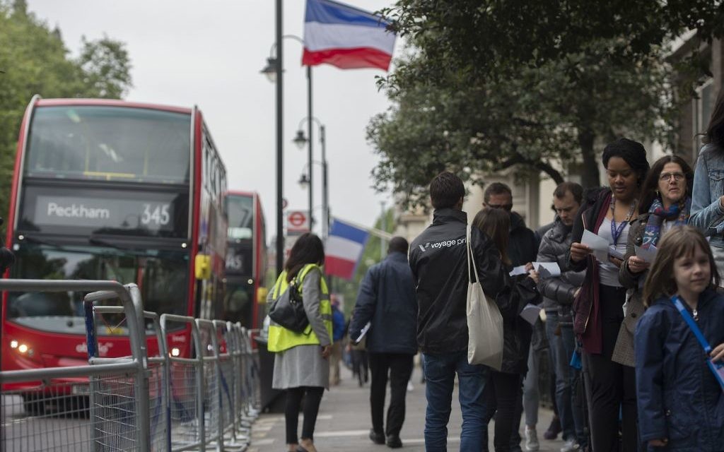 Expatriate voters prepare to cast their ballots for the second round of the French presidential election at a polling station at Lycee Francais Charles de Gaulle in south Kensington, London.