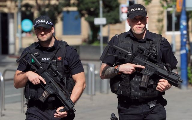 Armed police close to Manchester Arena, the morning after a suicide bomber killed 22 people after an Ariana Grande concert 


(Photo credit: Danny Lawson/PA Wire)
