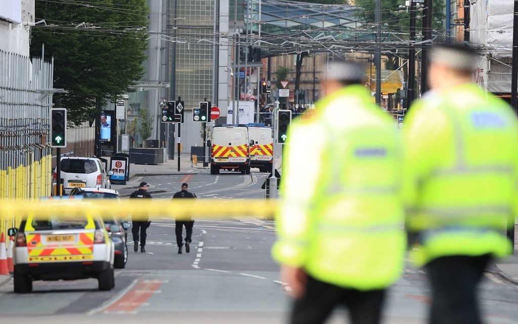 Police close to the Manchester Arena the morning after a terrorist attack at the end of a concert by US star Ariana Grande left 22 dead. 

Photo credit: Peter Byrne/PA Wire